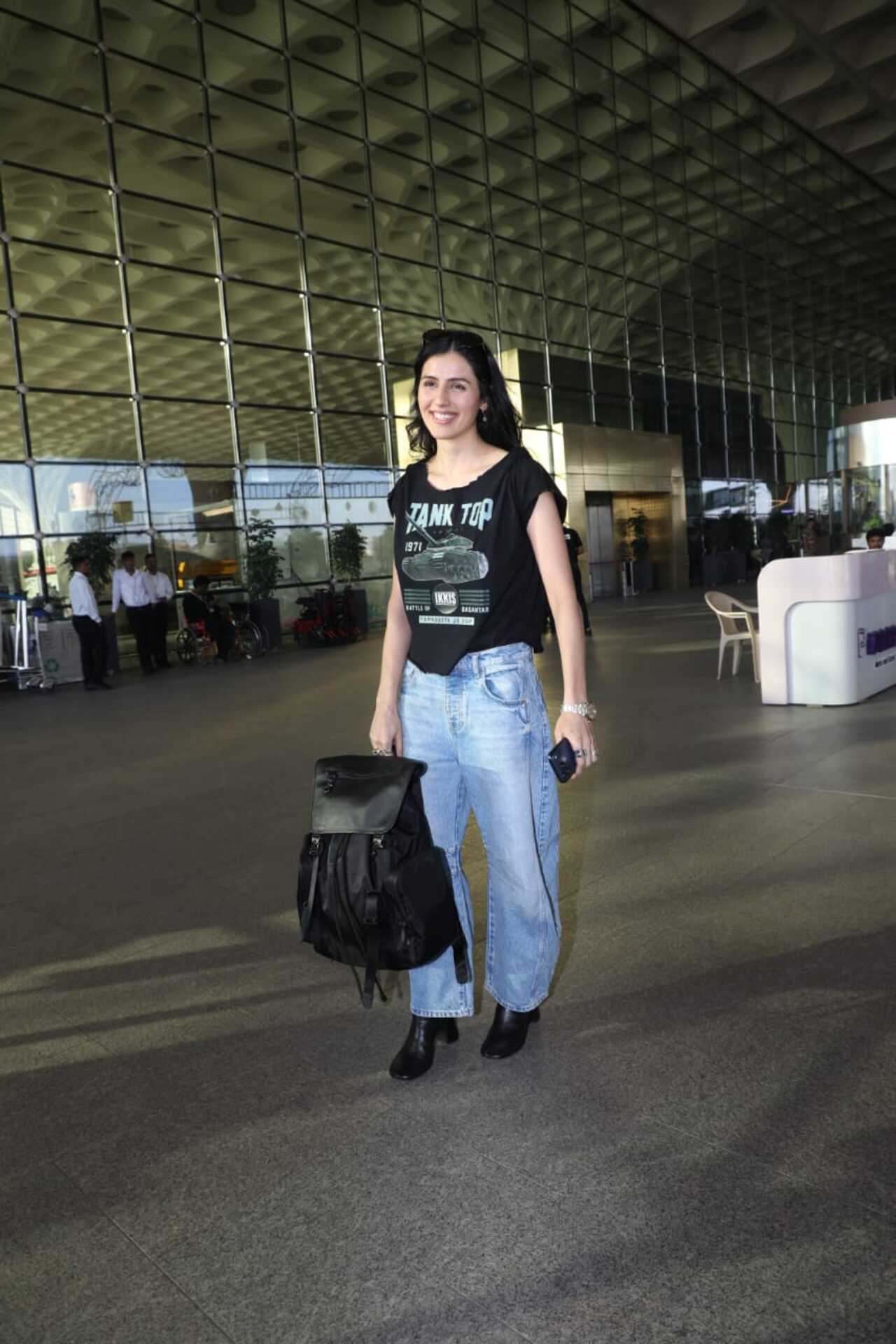 Ikkis star Simar Bhatia was papped at the airpost as she headed out of the city in a black t-shirt and blue jeans.
